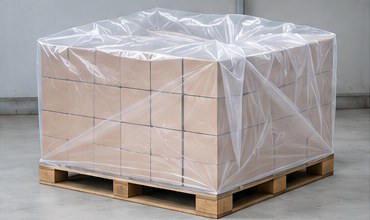 Clear PE cover over cartons stacked on a pallet